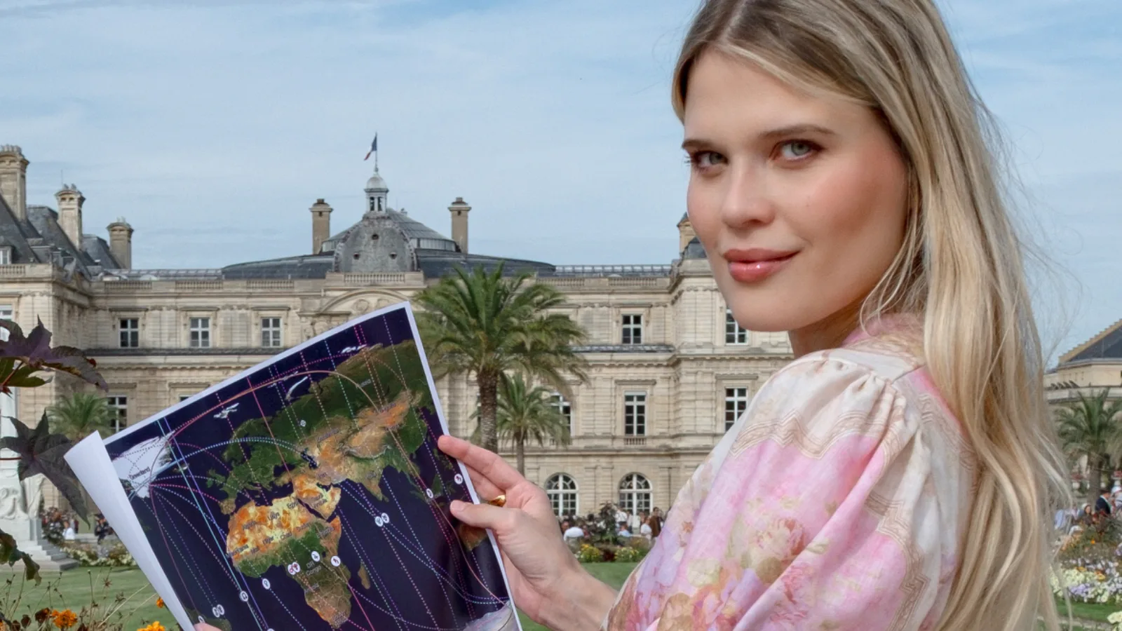 Astrologer Kristina Kamalova studying an astrocartography map